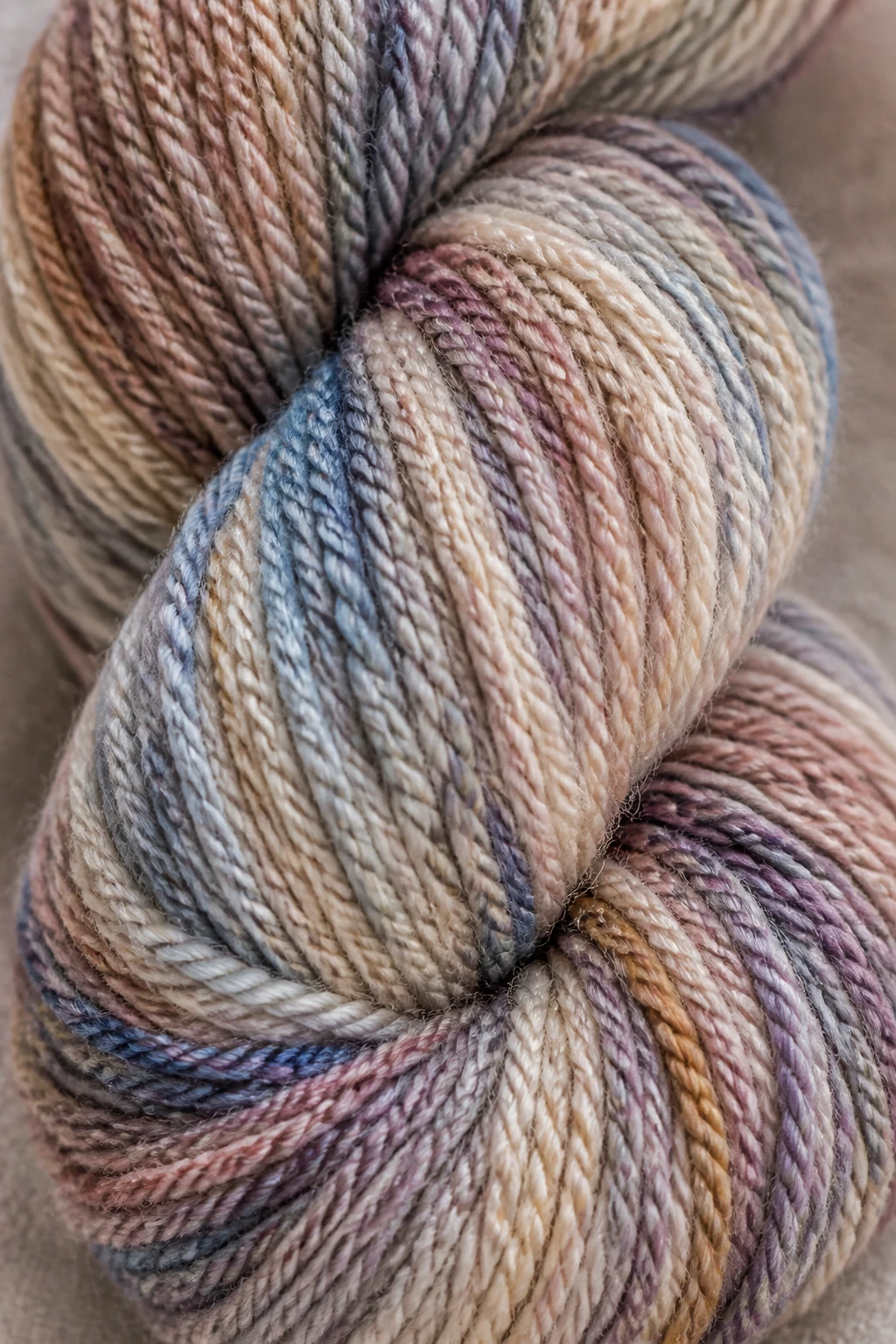 Closeup of a single wool blend hank showing stitch definition