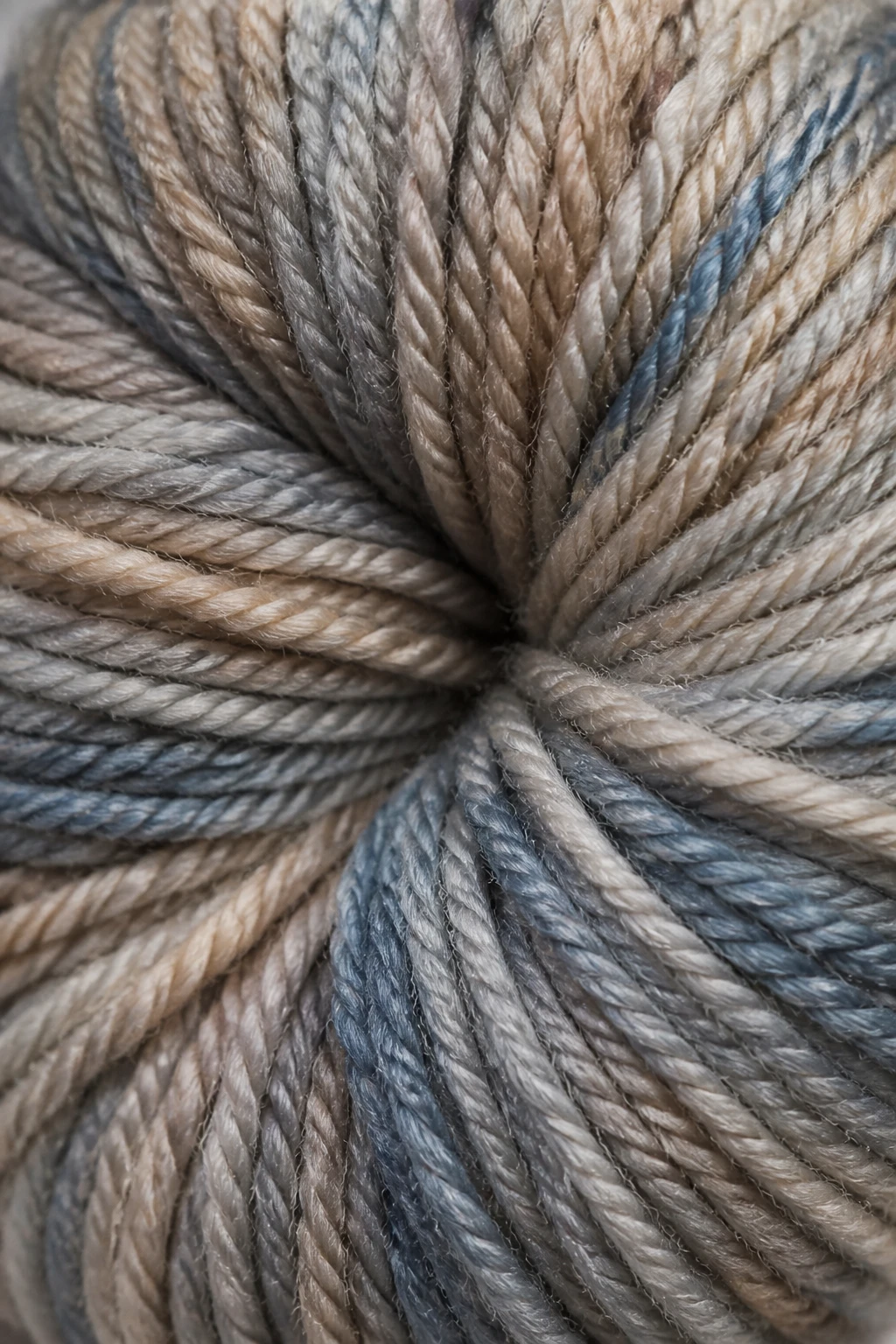 macro shot of yarn texture showing stitch definition, single skein center