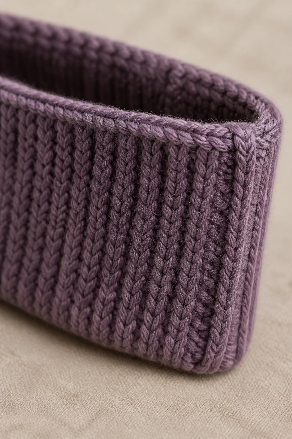 Tight portrait of a knit headband/ear warmer with seam edge visible