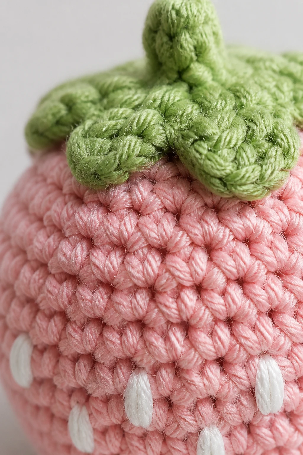 closeup of crisp stitch detail on 1–4 inch amigurumi piece
