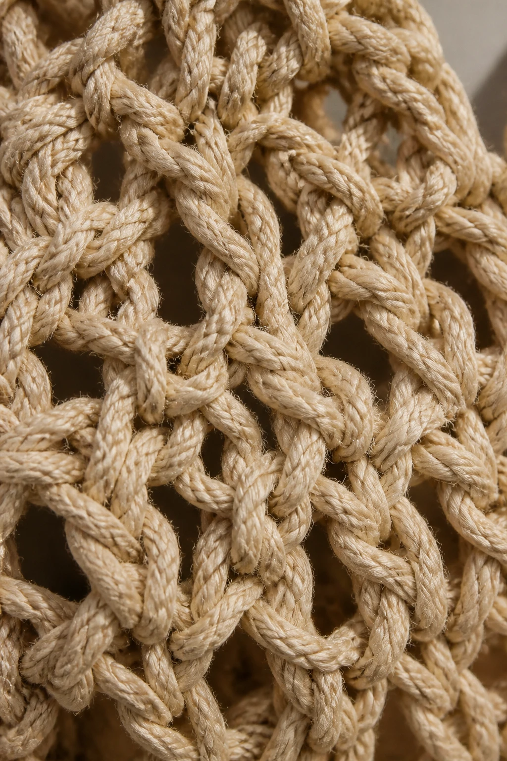 closeup of a market bag yarn texture, thick rope-like stitches