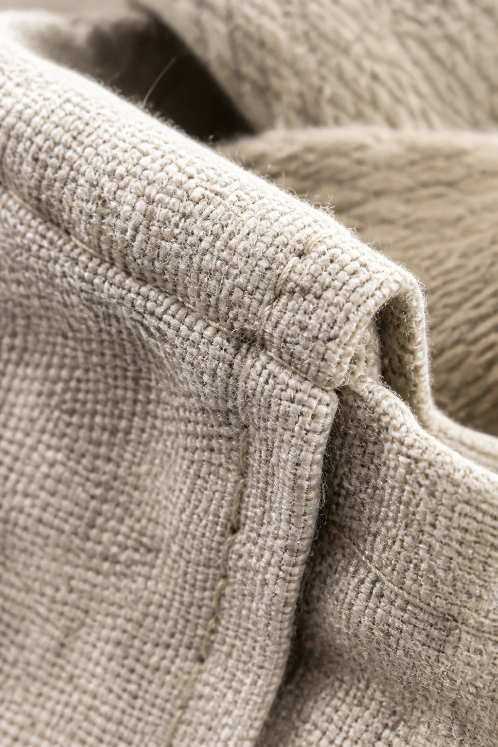 Macro of textured cotton-tshirt blend fibers on bag edge