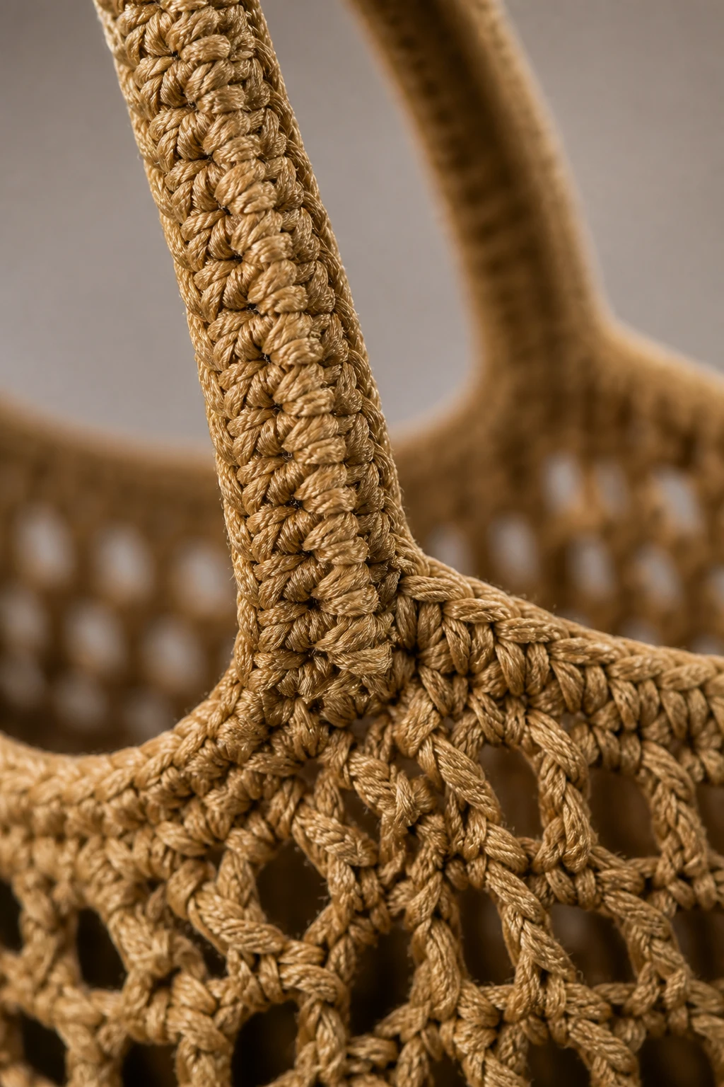 macro shot of tension and loop consistency on crochet market bag handle