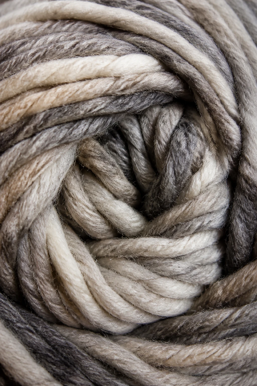 Closeup of chunky yarn skein wound into a ball, high texture details