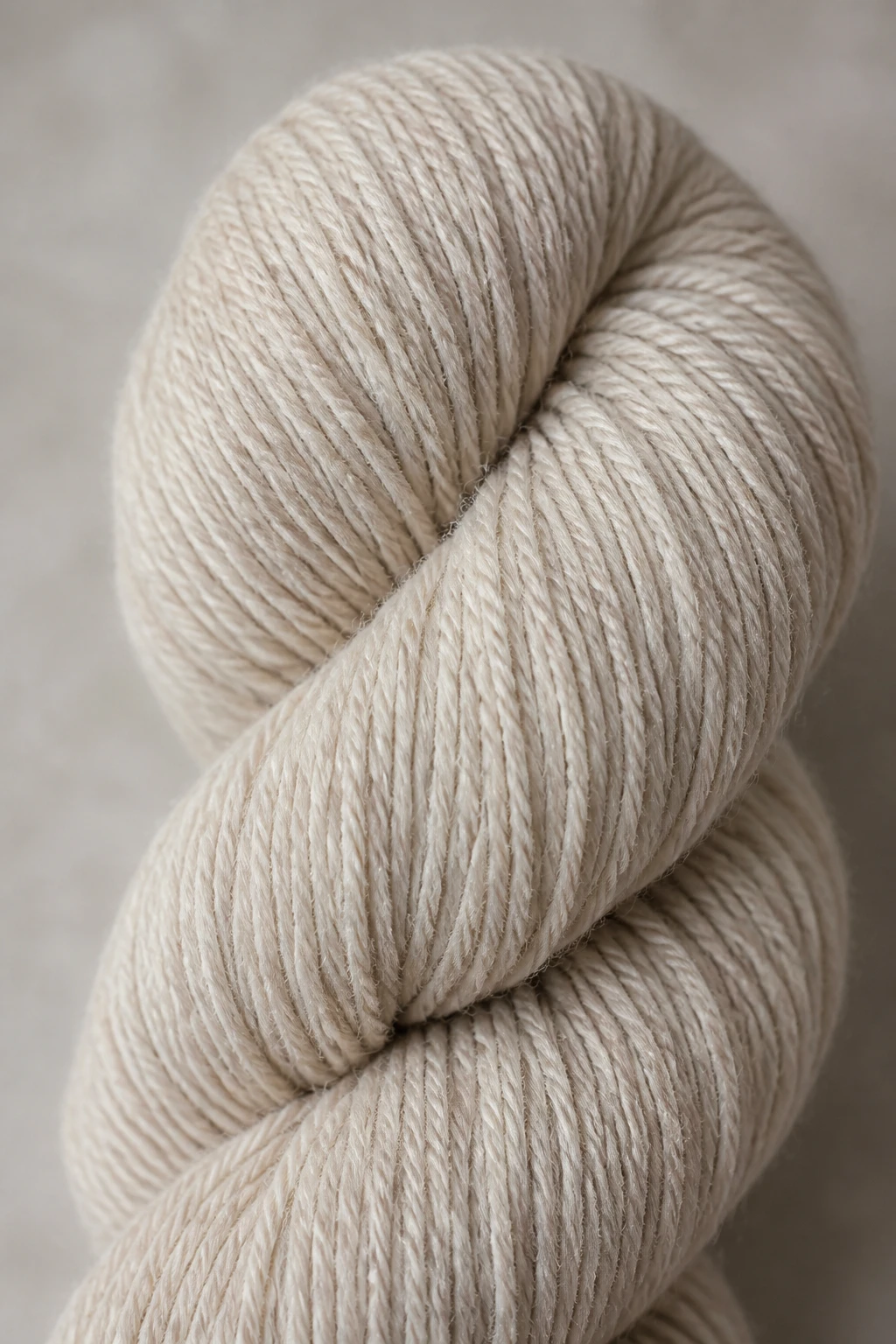 Closeup of a single merino blend yarn skein on neutral background