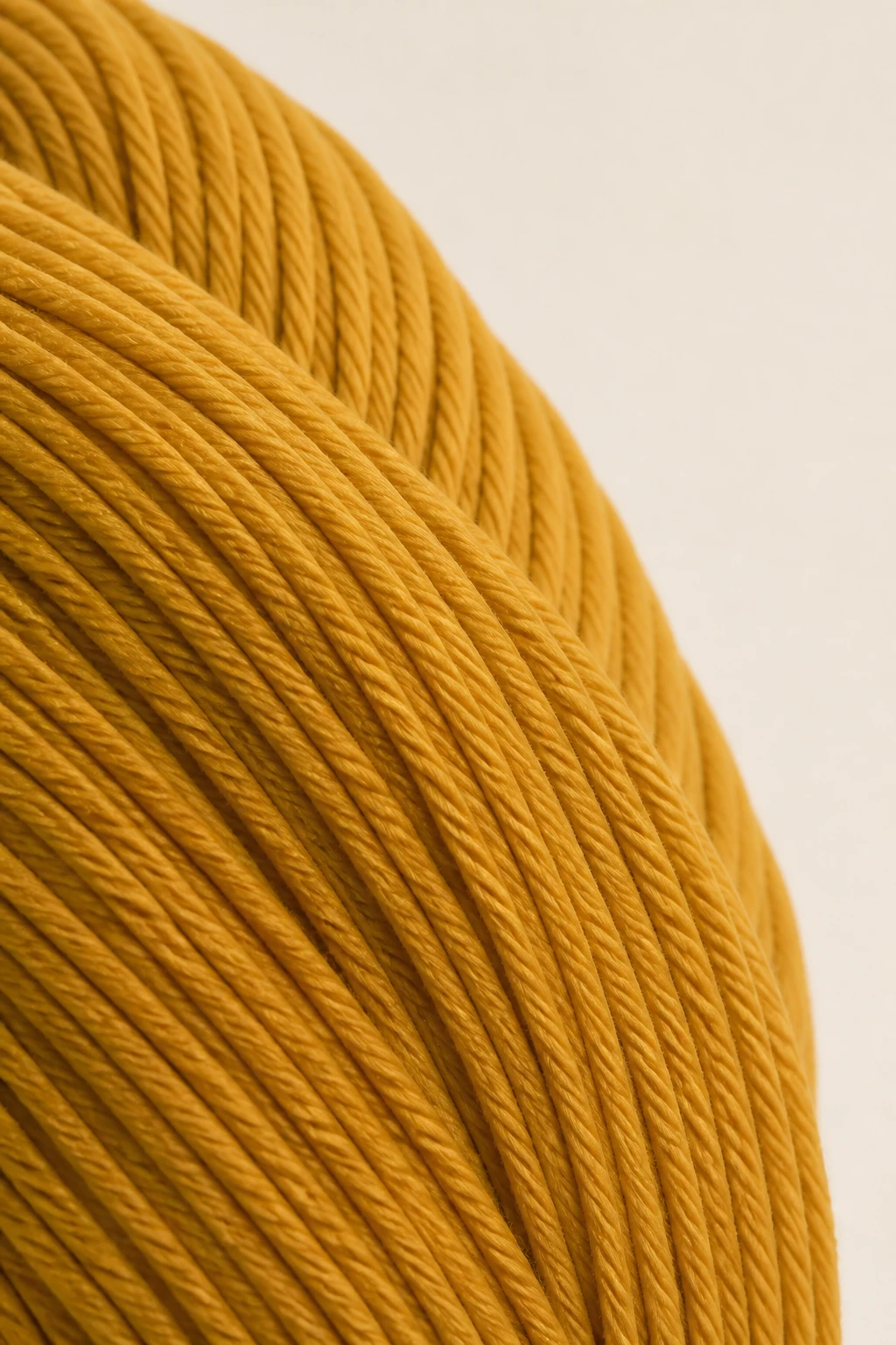 Closeup of smooth yarn texture in solid color with no fuzz on plain background