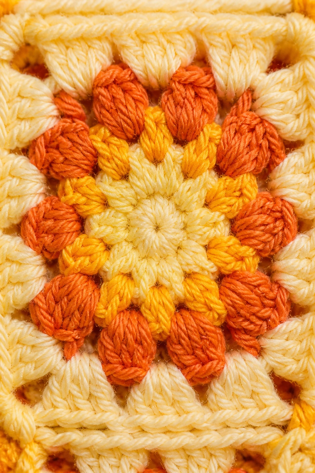 Macro shot showing warm-sunshine palette in crochet square